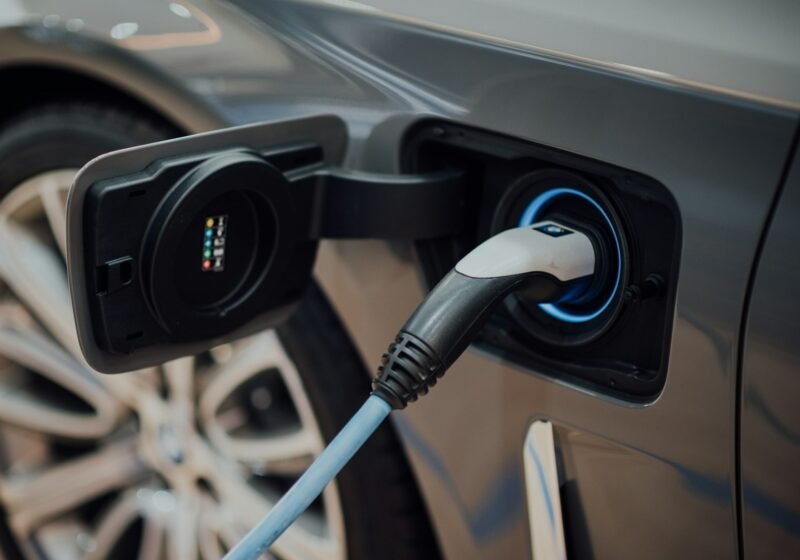 EV charging connector plugged into an electric vehicle