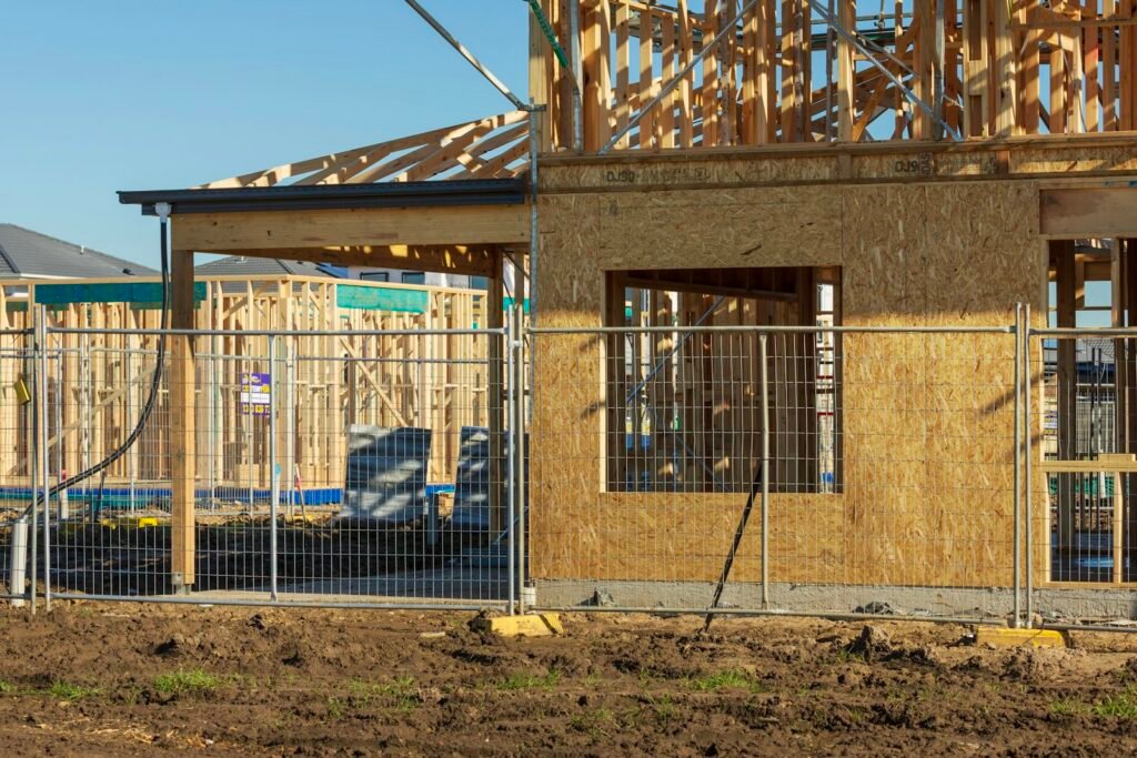 New home under construction with open wood framing