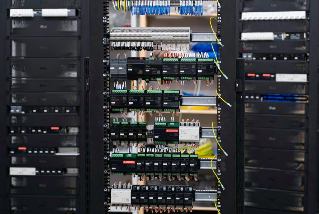 Open electrical distribution panel with organized wiring and breakers